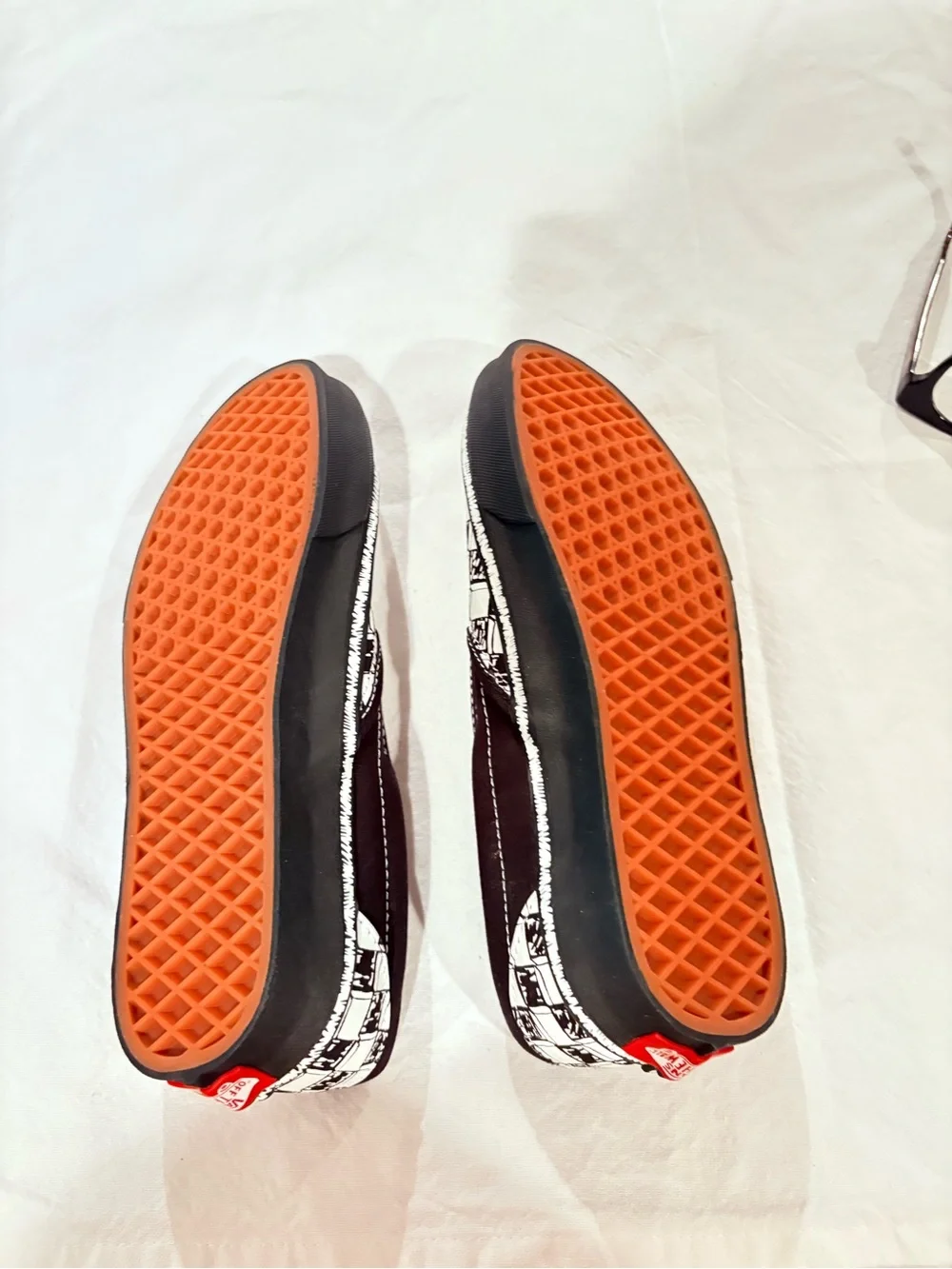 Vans Black and White Checkerboard Slip-On Sneakers